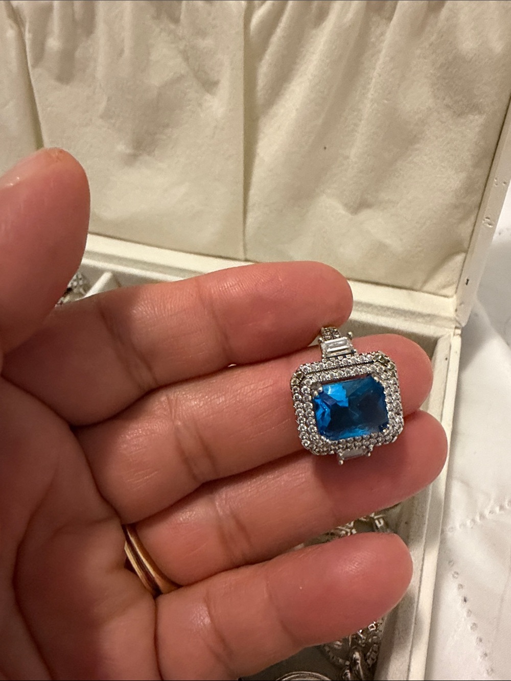 Silver Necklace Pendant with Blue Gemstone and Halo Accents